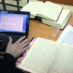 study Torah by using a laptop